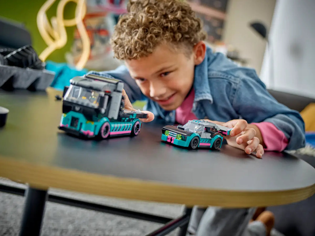 Child plays with lego city car and car carrier truck 60406